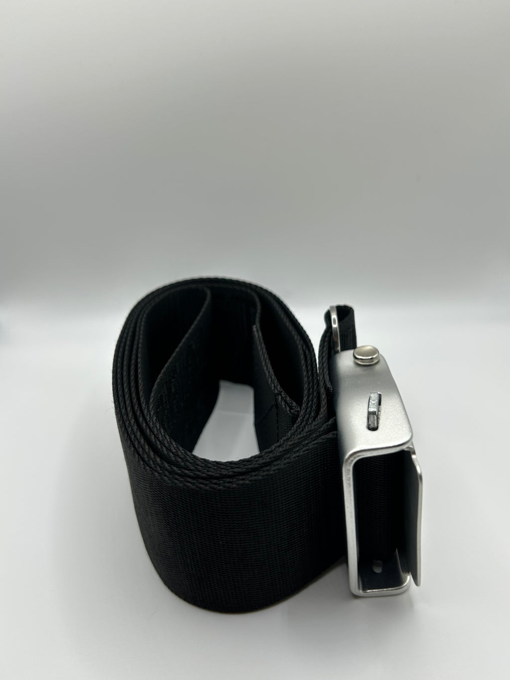 Gym seatbelt used on a leg extension machine